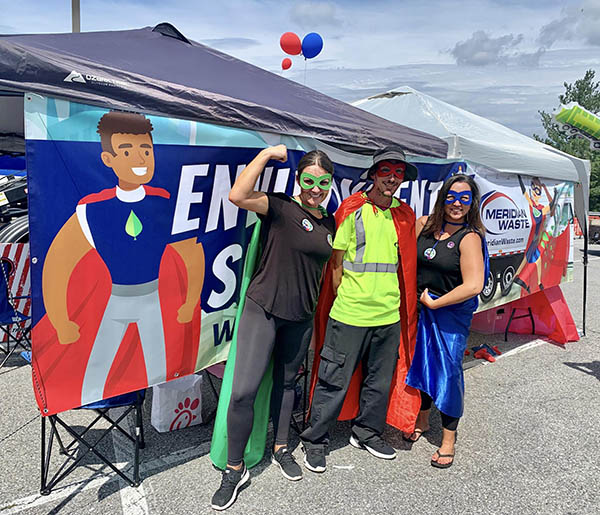 Meridian Waste General Manager Ashleigh Garnes, Driver Chris Dowdy, and Sales Manager Andrea Altis show off their superhero capes.