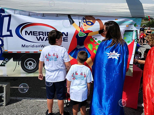 Sales Manager Andrea Altis and her family show their industry pride with shirts saying, “Someone I love is a Superhero at Meridian Waste.”