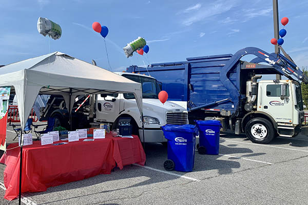 Meridian Waste’s Touch-A-Truck display featured a container truck and a front-load truck. The booth provided an educational display with Trash Facts and Recycling Revelations about the average American’s impact on the environment every year.