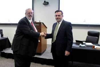 Bruce Stanger (left) was presented with a five-year service award from VFBF president Wayne Pryor (right)