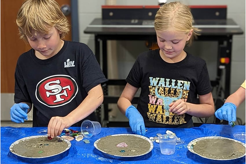 Grade schoolers make stepping stones 24