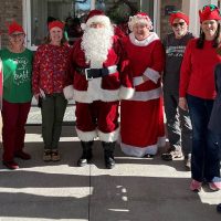 Santa and Elves of Volunteer Montgomery L to R: (Alex Strickler, Carol Trutt, Jennifer Ament, Santa, Mrs. Claus, Robbie Hall, Mandy Hayes, Karen Anders)